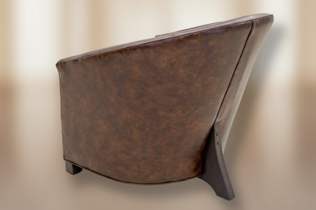 brown leather chair with a neutral background