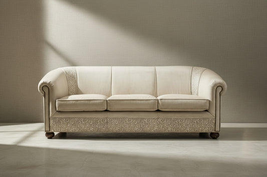 ivory tooled leather sofa placed in a neutral room setting