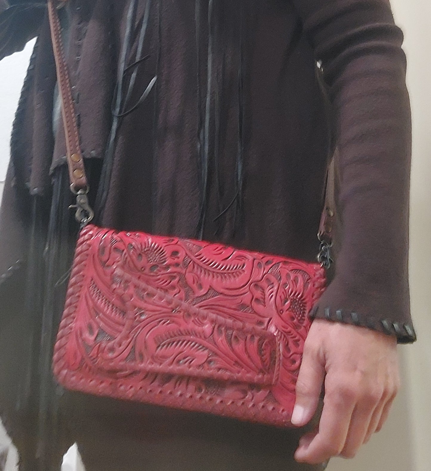 person in real life holding purse for size reference