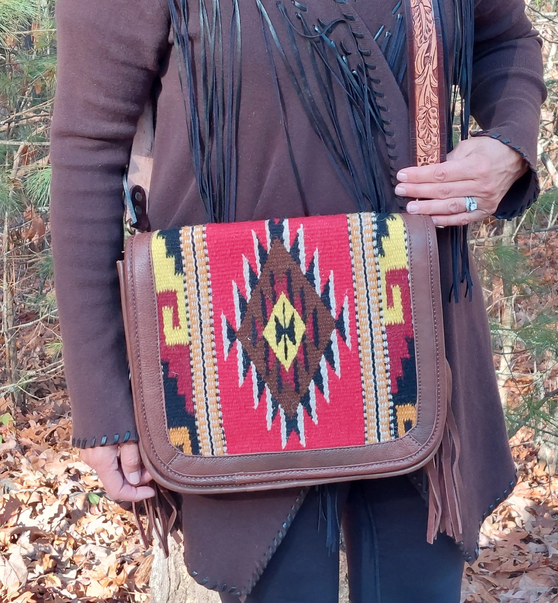 person in real life holding messenger bag for size reference