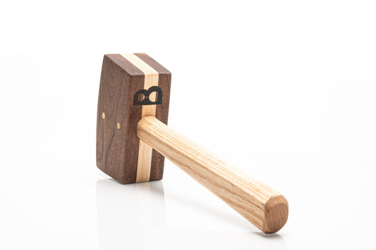 Diamond W Ranch black walnut ice mallet with light maple stripe and B logo, three-quarter view on white