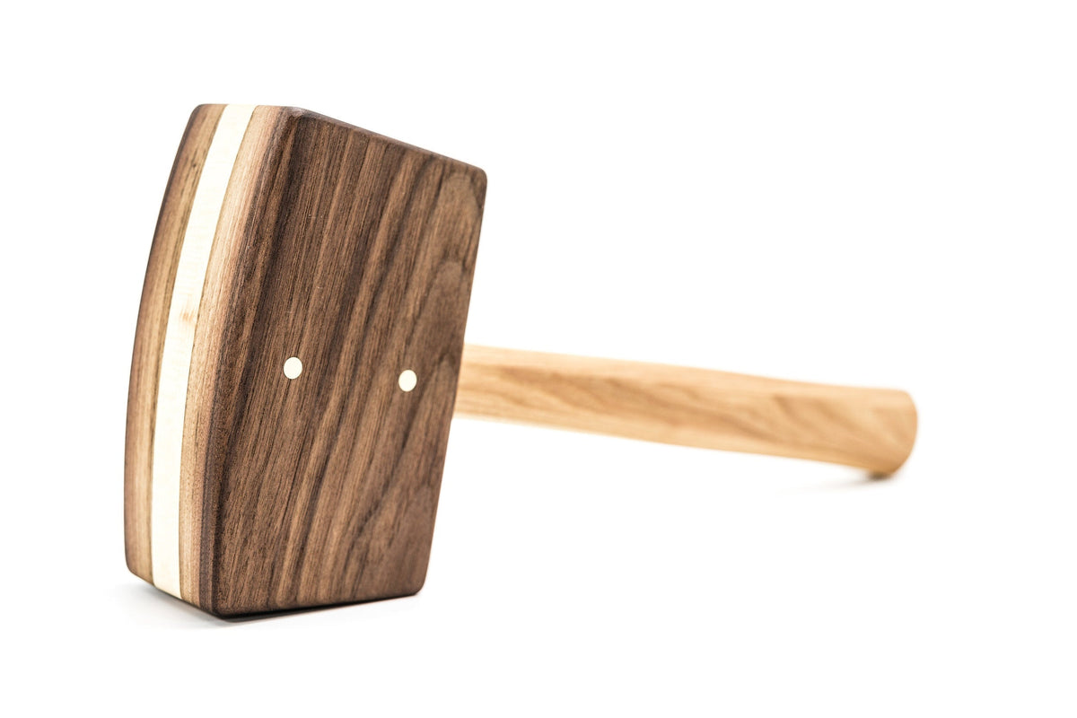 Diamond W Ranch black walnut ice mallet, side view showing the striped head and light wood handle on white