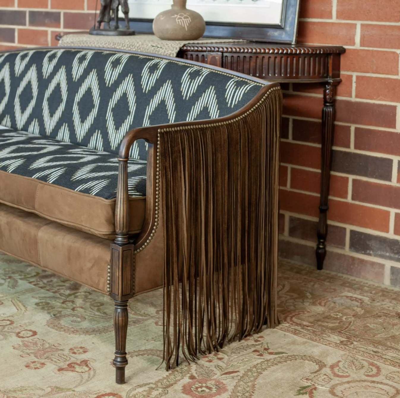 Old Hickory Tannery couch with Sioux midnight fabric and fringe detail
