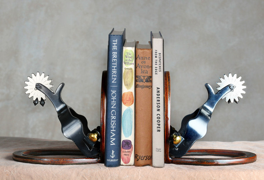 Two spur bookends supporting 4 books