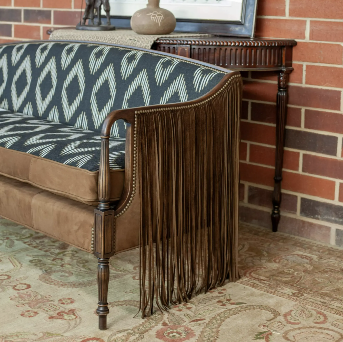 brown suede chair with fringe